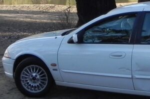 Cropped white car station wagon